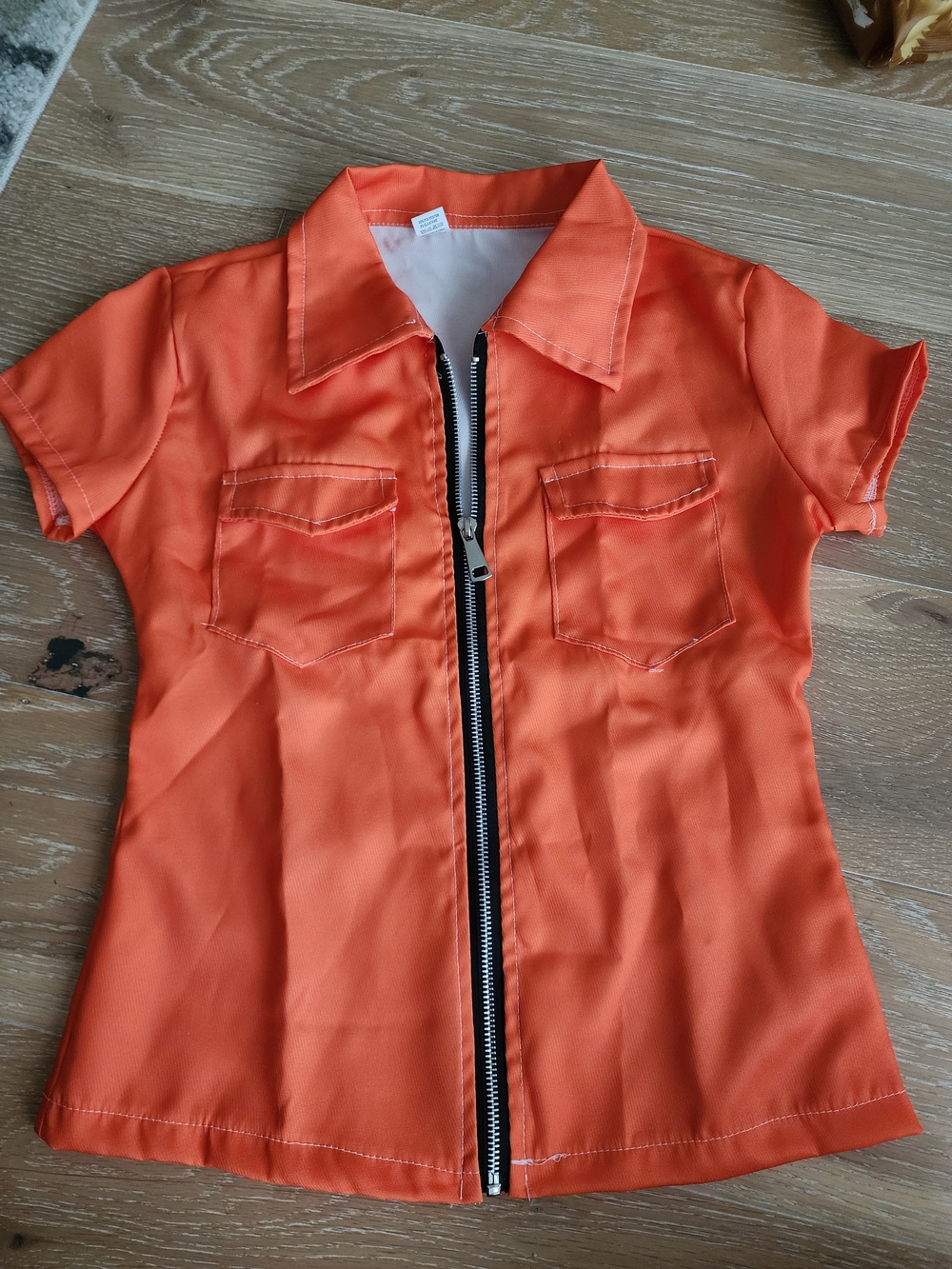 NWOT Orange Short Sleeve Zip Front Top Fits Like Small,  Sz M